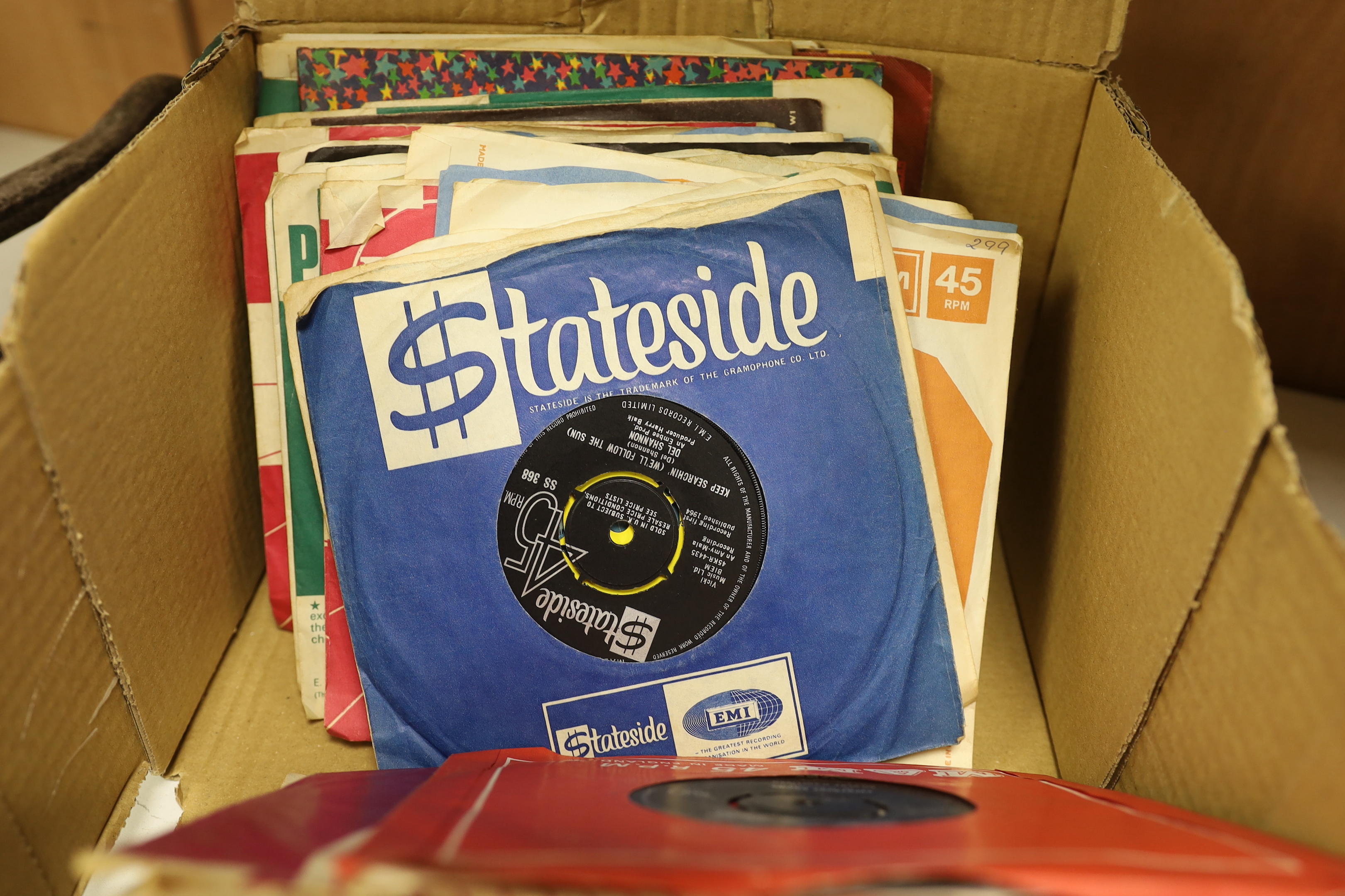 A collection of 45rpm 7 inch singles, artist include Elvis Presley, the Beatles, Creedence Clearwater Revival, T-Rex, Tom Jones, Cat Stevens, etc. (nine Beatles singles)